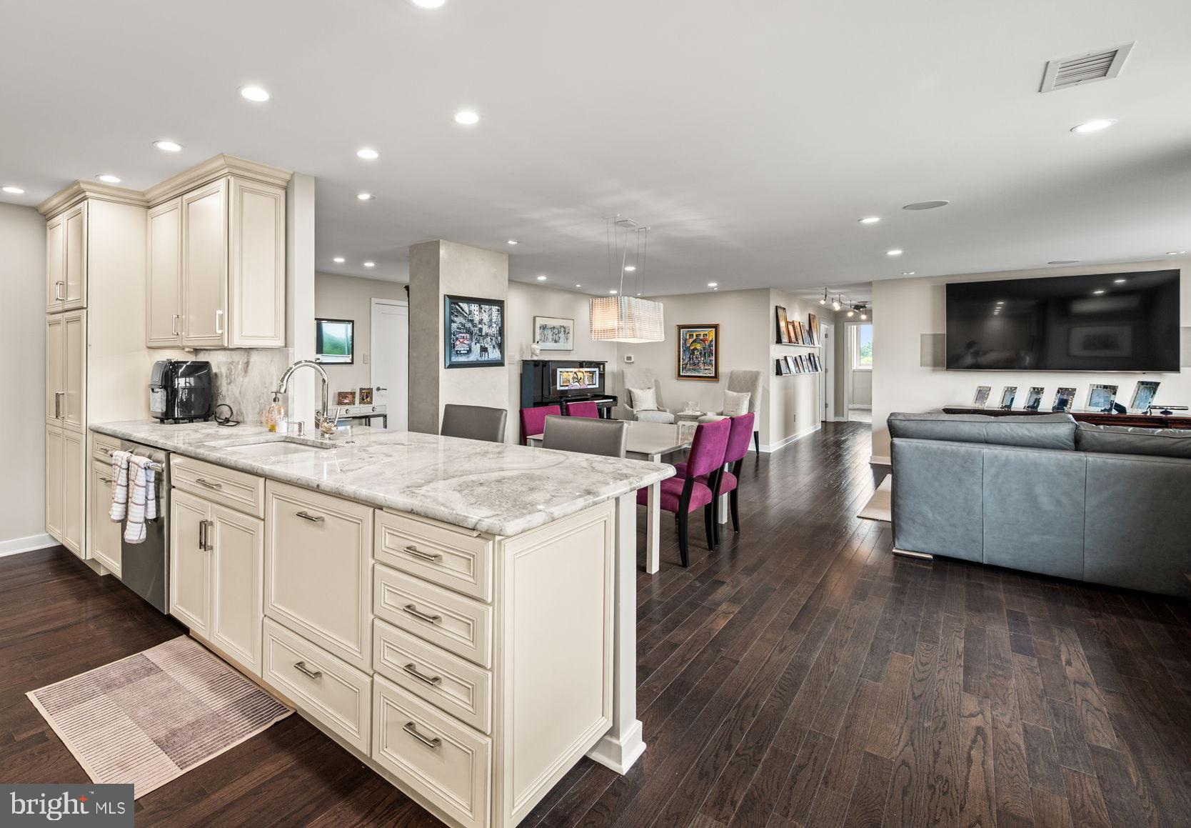 191 Presidential Boulevard, Unit R828 Bala Cynwyd, PA 19004 - Photo 21 of 50 a kitchen with stainless steel appliances kitchen island granite countertop a large island in the center