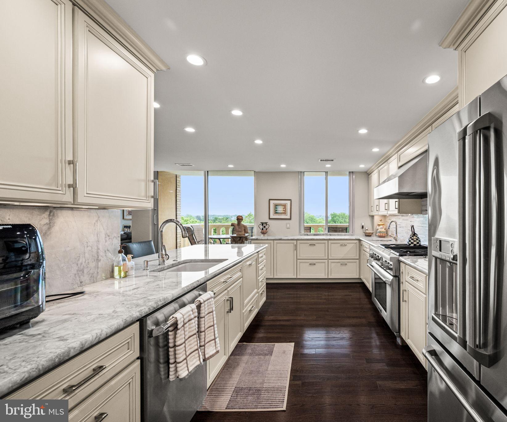 191 Presidential Boulevard, Unit R828 Bala Cynwyd, PA 19004 - Photo 25 of 50 a large kitchen with granite countertop lots of counter top space