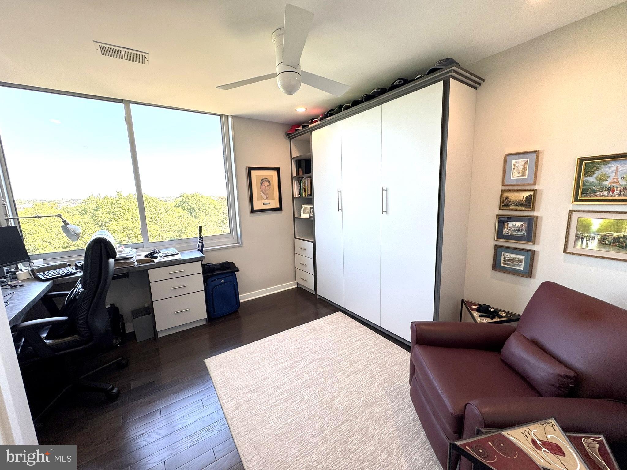 191 Presidential Boulevard, Unit R828 Bala Cynwyd, PA 19004 - Photo 34 of 50 a living room with furniture and large windows