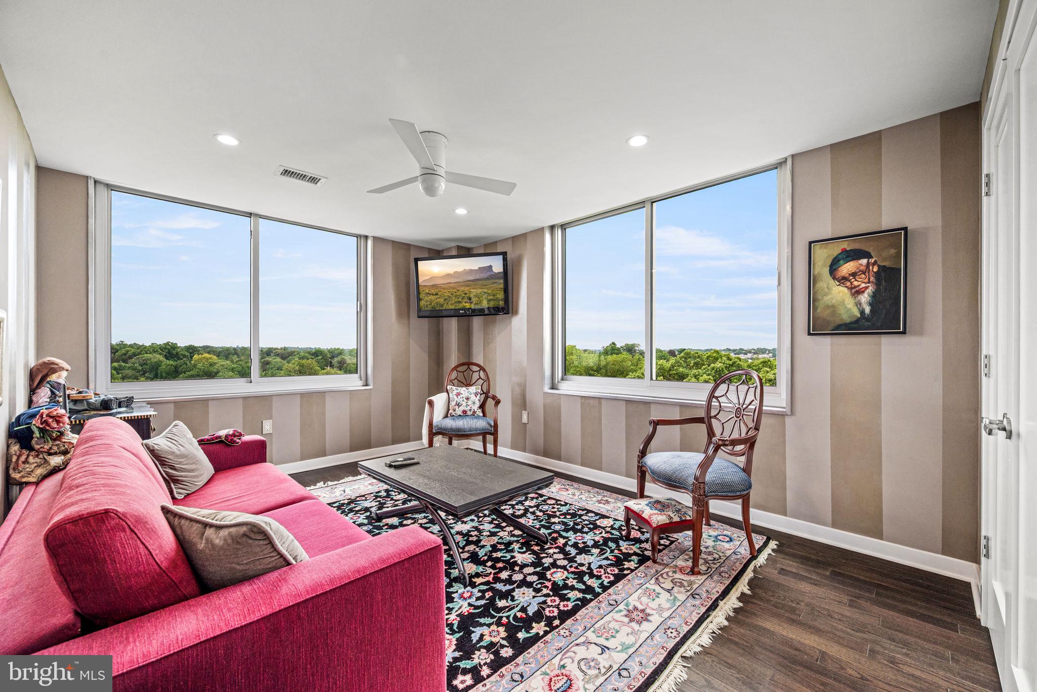 191 Presidential Boulevard, Unit R828 Bala Cynwyd, PA 19004 - Photo 37 of 50 a living room with furniture and a floor to ceiling window
