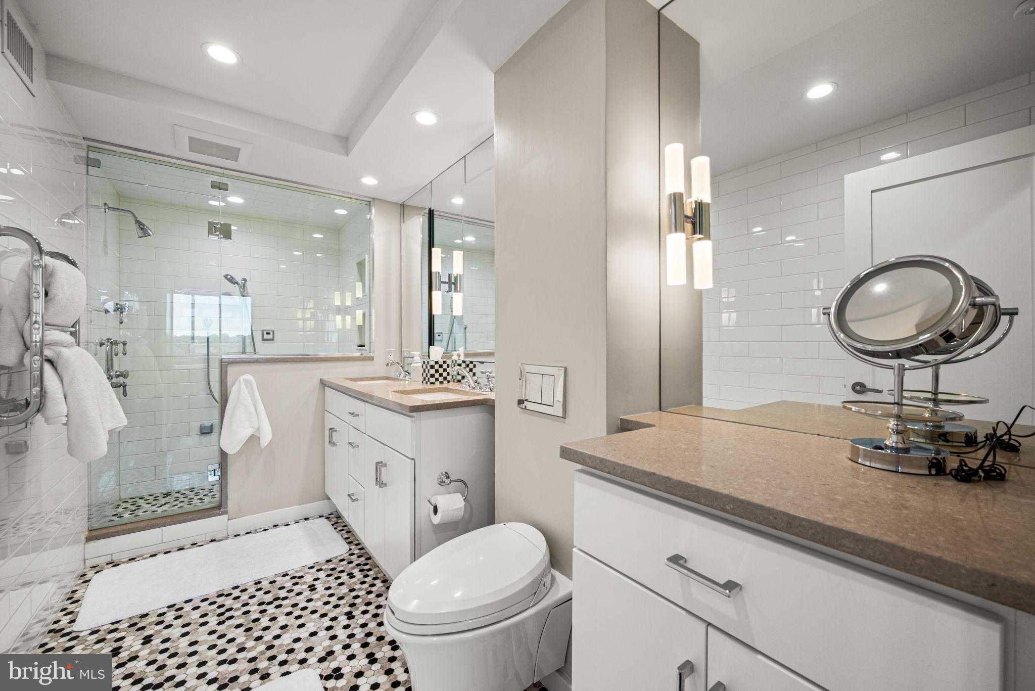 191 Presidential Boulevard, Unit R828 Bala Cynwyd, PA 19004 - Photo 43 of 50 a bathroom with a toilet a sink and a mirror