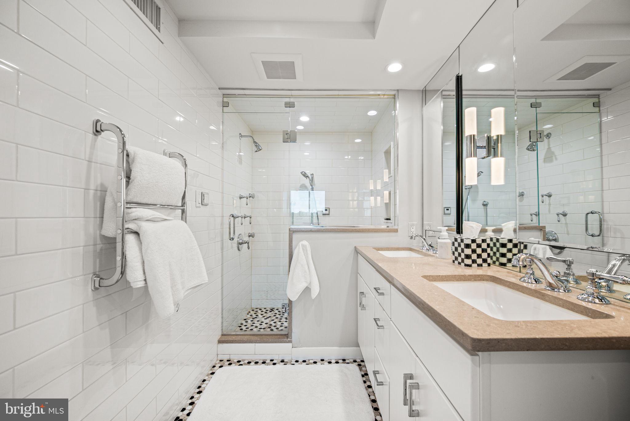 191 Presidential Boulevard, Unit R828 Bala Cynwyd, PA 19004 - Photo 44 of 50 a bathroom with a sink a toilet and shower