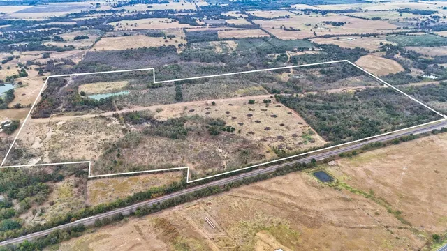 a view of balcony with wooden floor