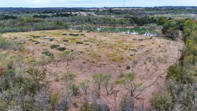 a view of a lake with a yard