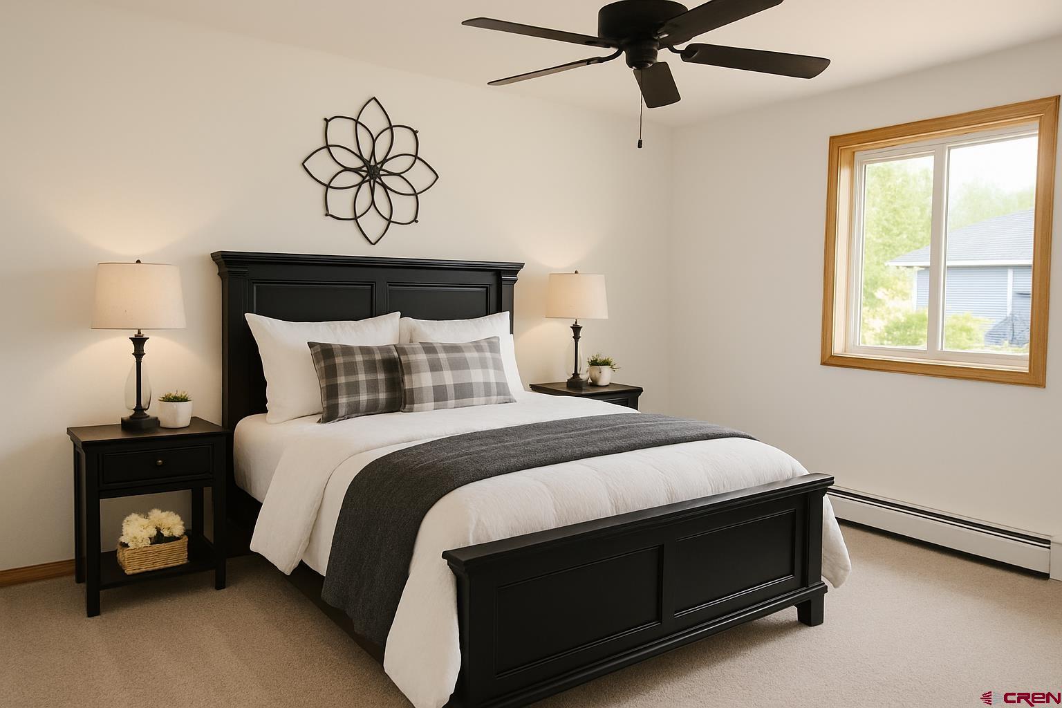 14894 Deer Run Road Delta, CO 81416 - Photo 15 of 40 a bedroom with a bed and window