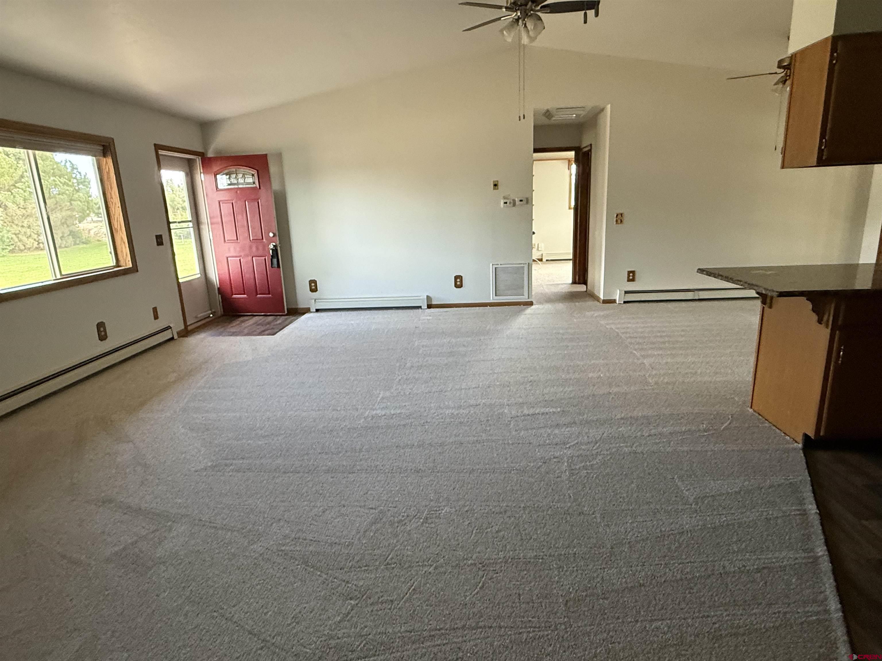 14894 Deer Run Road Delta, CO 81416 - Photo 18 of 40 a view of an empty room with a window