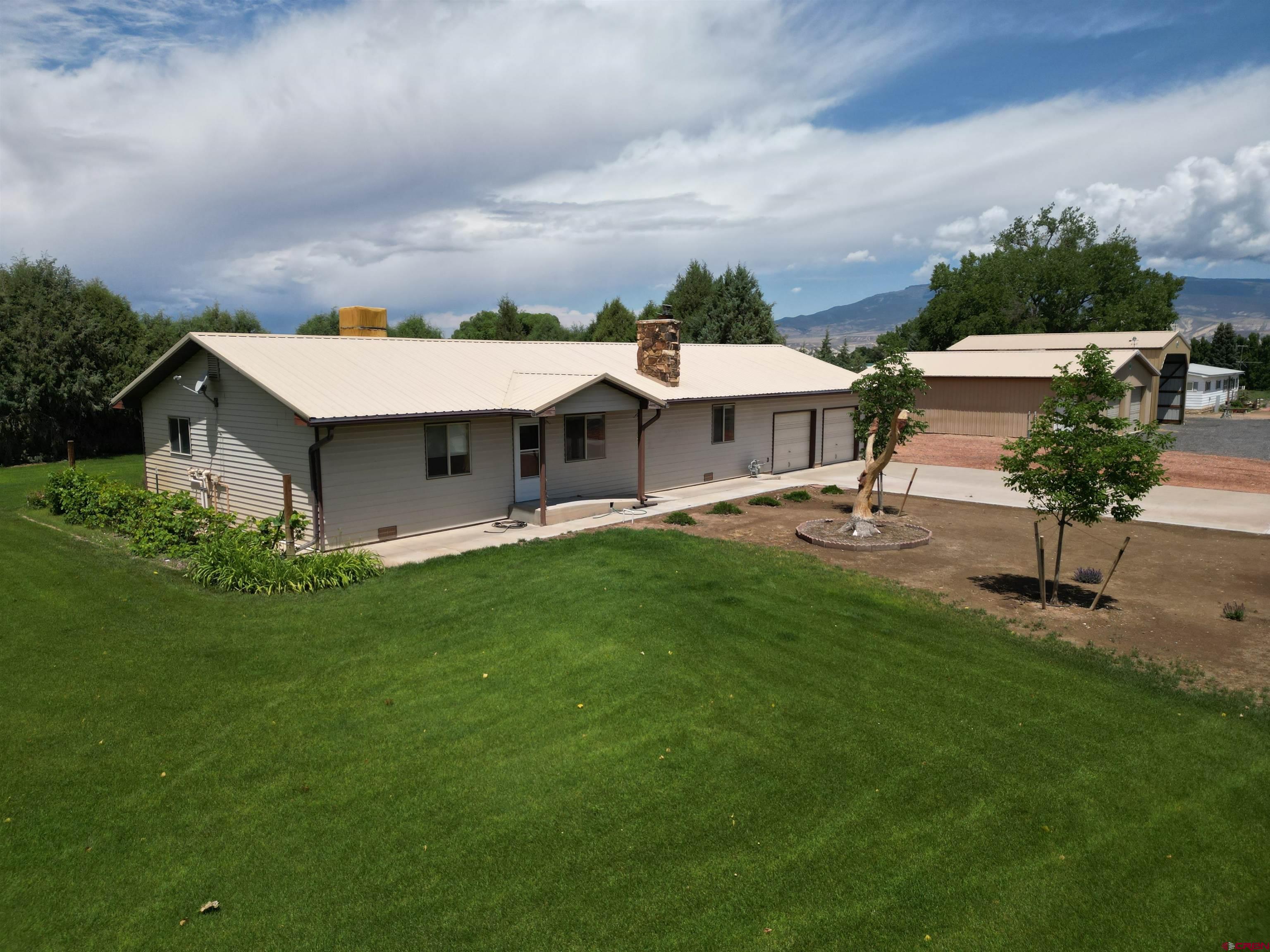 14894 Deer Run Road Delta, CO 81416 - Photo 2 of 40 an aerial view of a house with garden space and street view