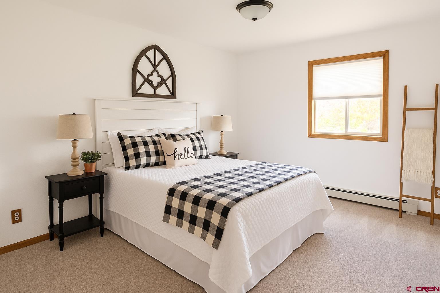 14894 Deer Run Road Delta, CO 81416 - Photo 23 of 40 a bedroom with a bed and a window