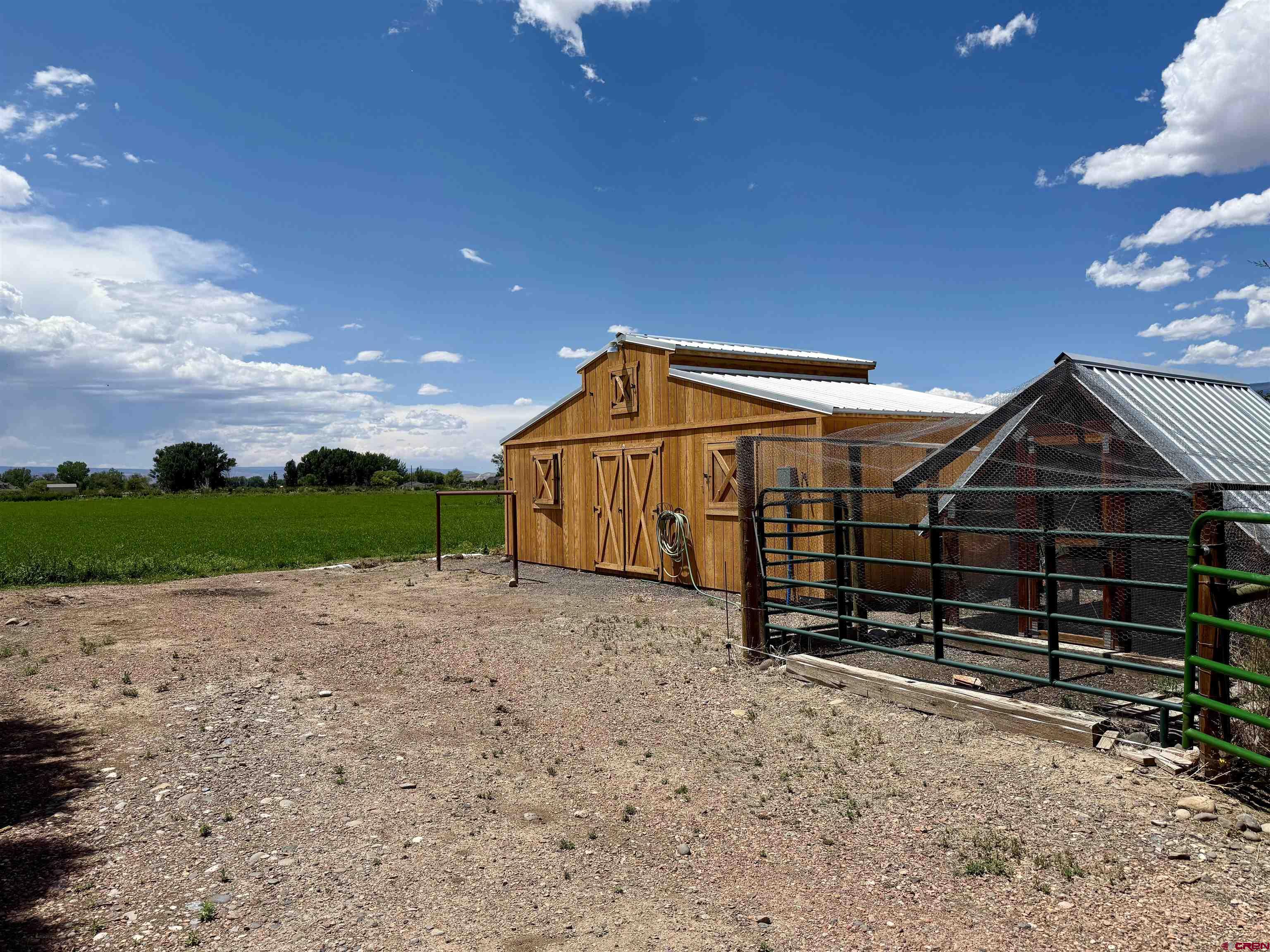 14894 Deer Run Road Delta, CO 81416 - Photo 28 of 40 a front view of a house with a yard