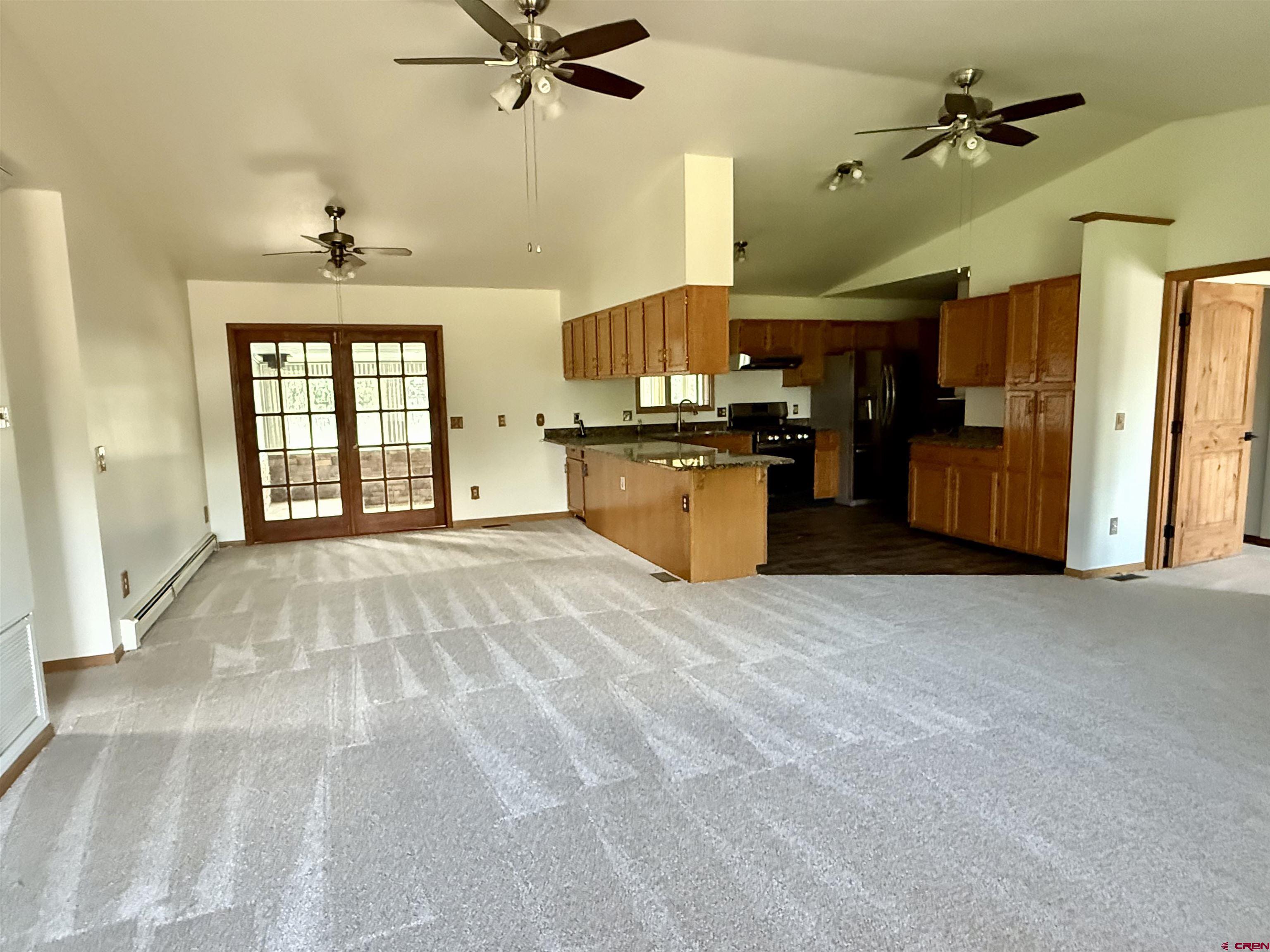14894 Deer Run Road Delta, CO 81416 - Photo 7 of 40 a view of a kitchen with a sink hardwood floor and a window