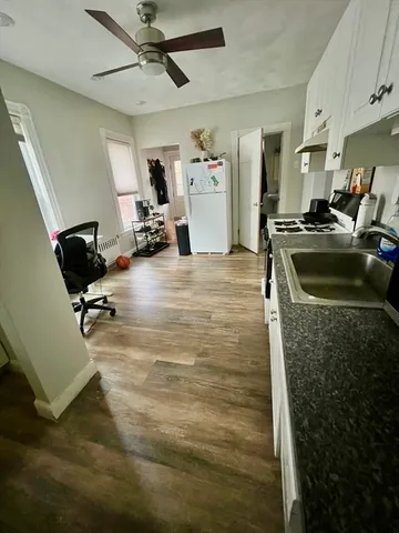 a view of a gym equipment and kitchen view