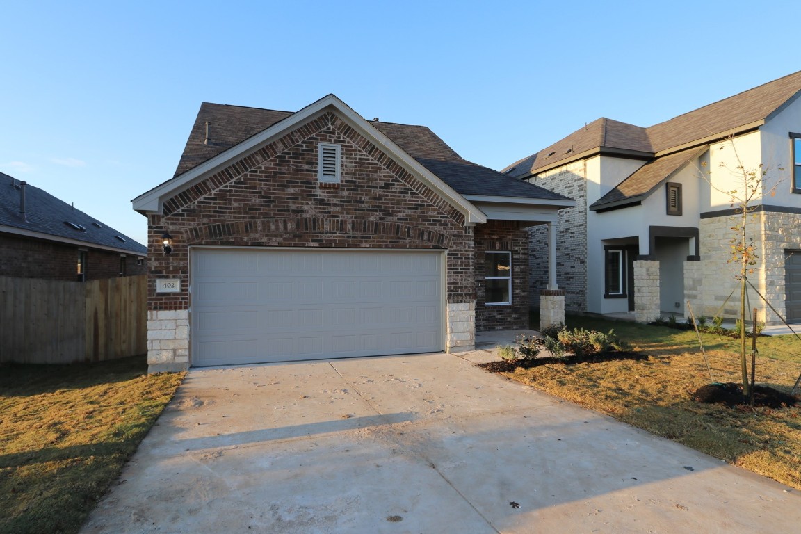 402 Pepperbark Loop Buda, TX 78610 - Photo 1 of 1 a front view of a house
