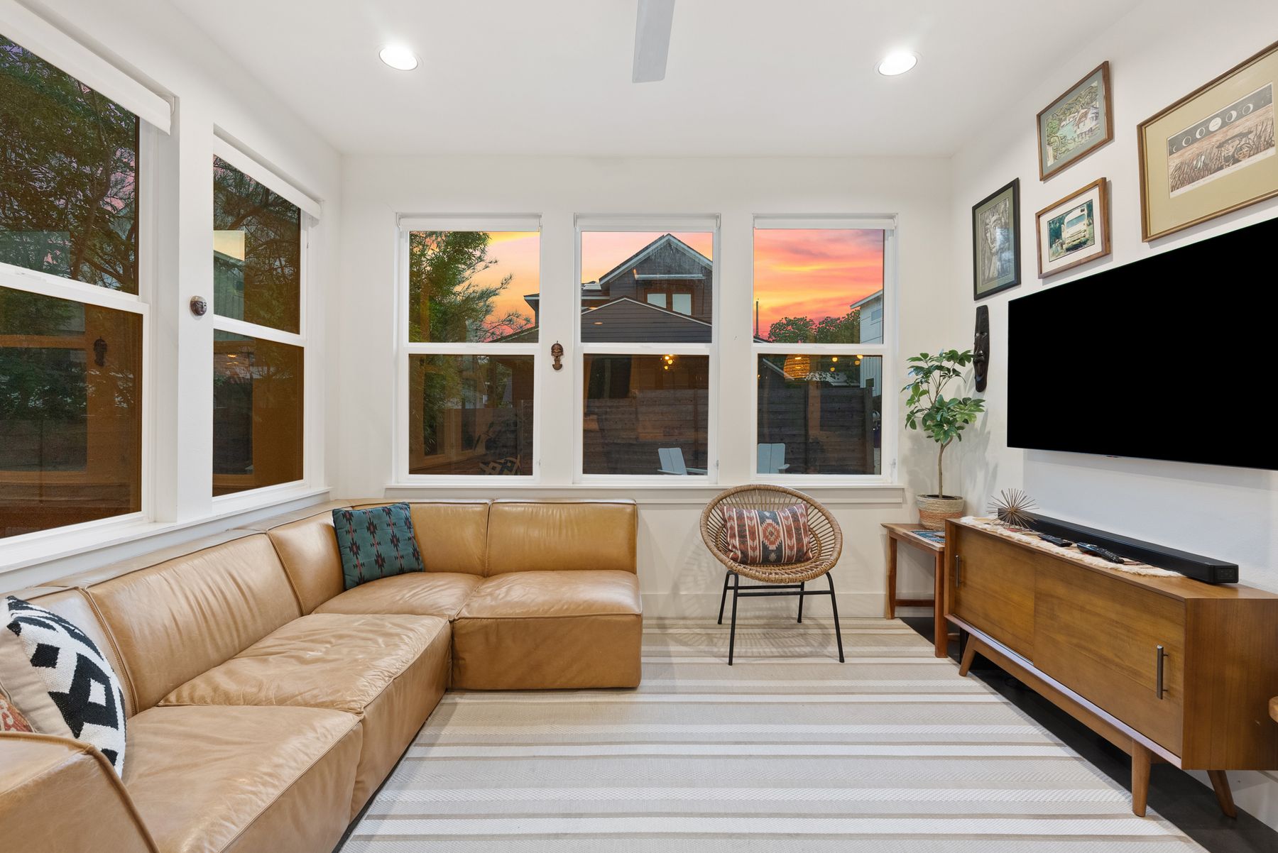 1709 Perez Street, Unit 2 Austin, TX 78721 - Photo 7 of 33 Natural light streams into this living area, offering picturesque views through large, well-appointed windows.