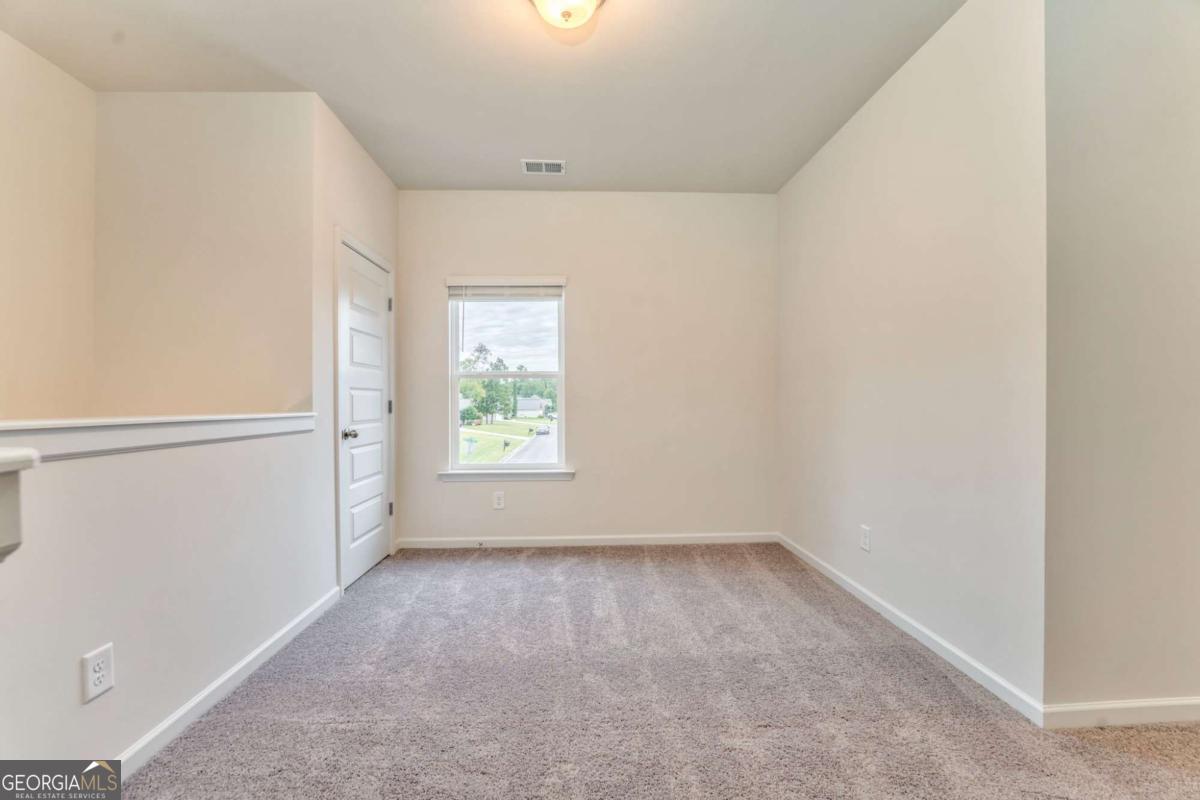 8 Majestic Oaks Way Northeast Rome, GA 30165 - Photo 11 of 25 an empty room with windows