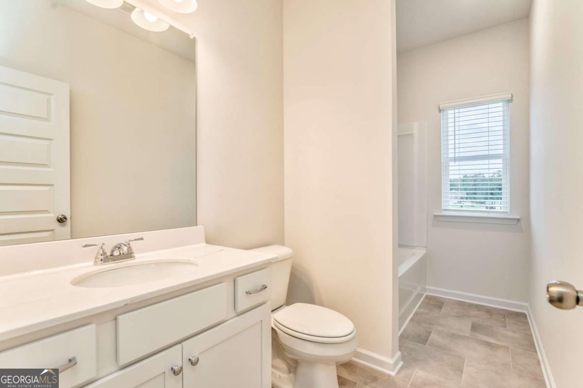8 Majestic Oaks Way Northeast Rome, GA 30165 - Photo 14 of 25 a bathroom with a sink toilet and vanity