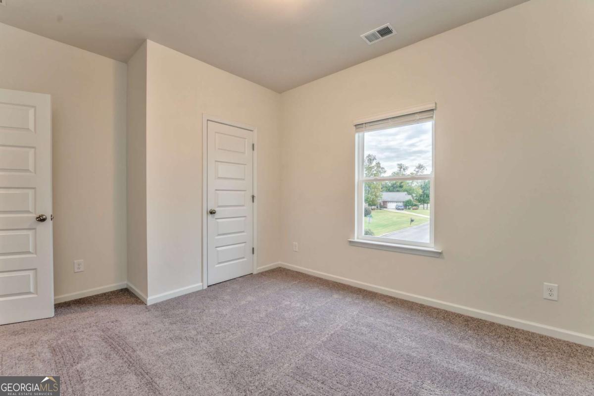 8 Majestic Oaks Way Northeast Rome, GA 30165 - Photo 16 of 25 an empty room with windows and closet
