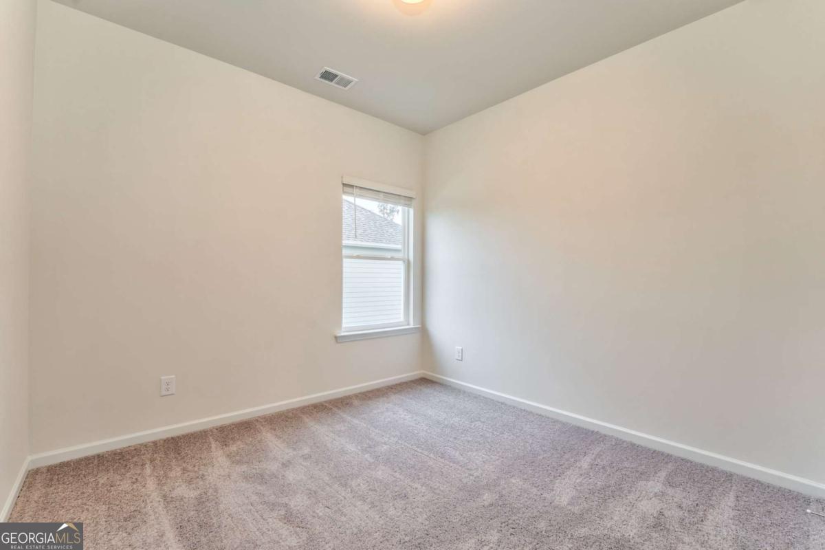 8 Majestic Oaks Way Northeast Rome, GA 30165 - Photo 17 of 25 an empty room with a window