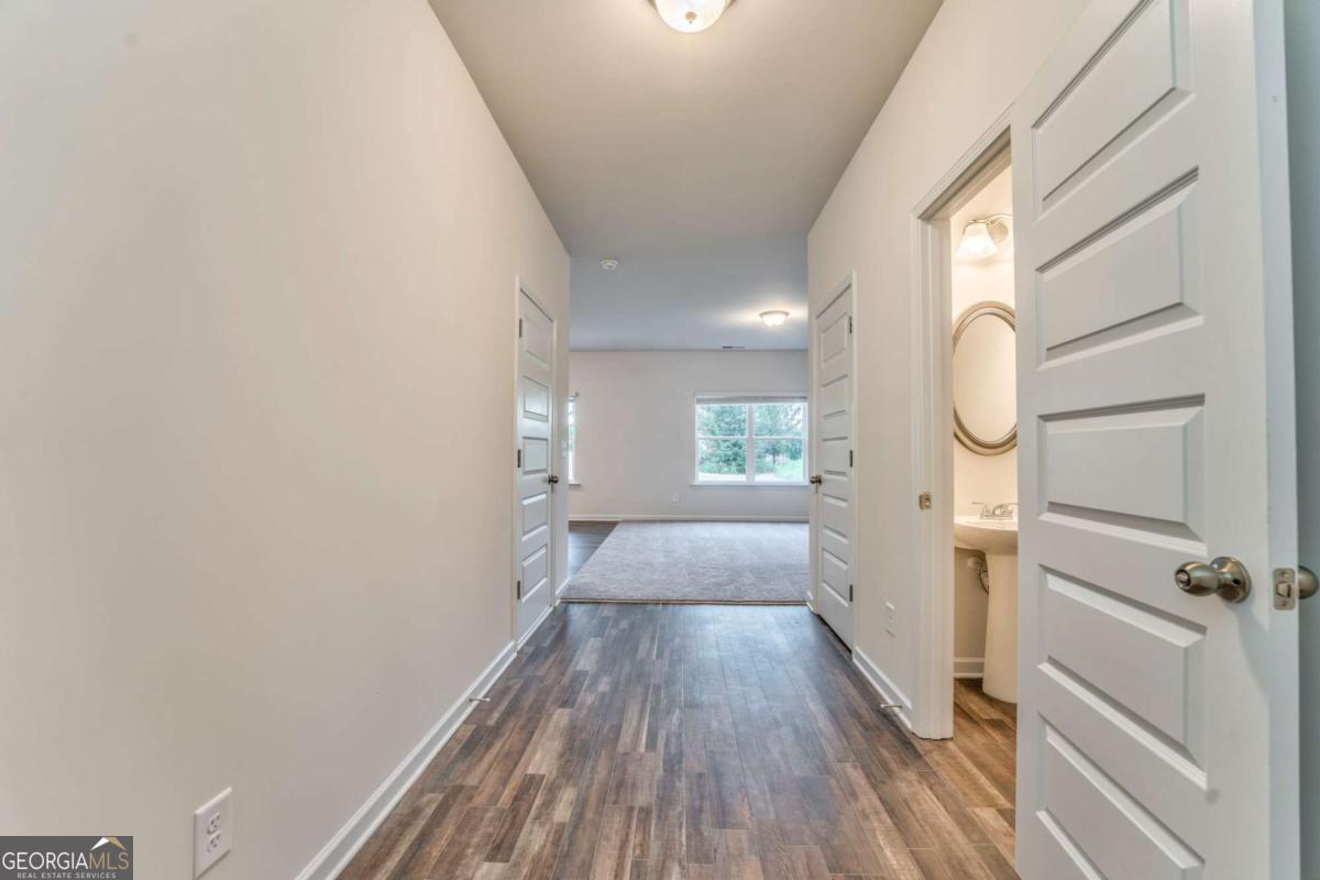 8 Majestic Oaks Way Northeast Rome, GA 30165 - Photo 3 of 25 wooden floor in an empty room with a window