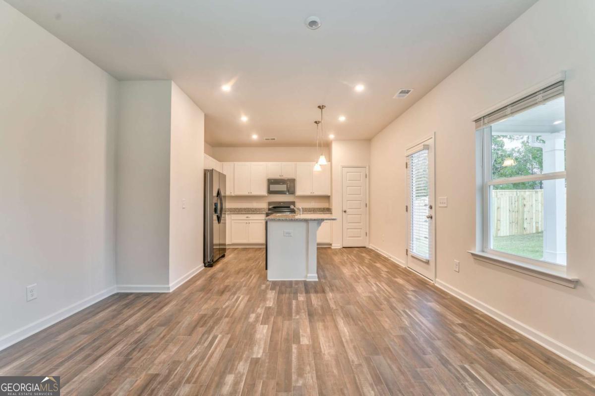 8 Majestic Oaks Way Northeast Rome, GA 30165 - Photo 6 of 25 a view of kitchen with wooden floor and electronic appliances