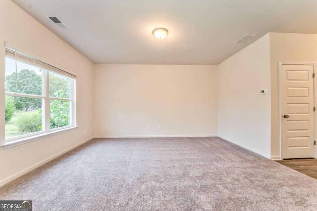 8 Majestic Oaks Way Northeast Rome, GA 30165 - Photo 7 of 25 an empty room with a window