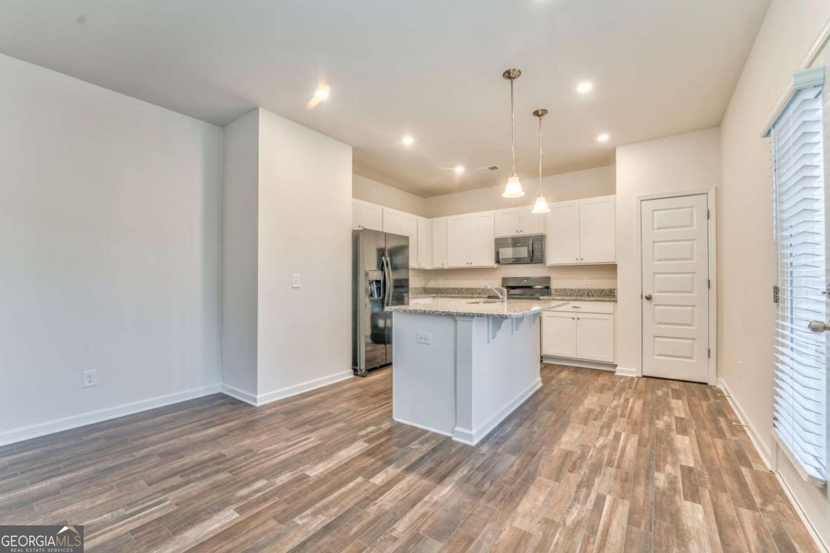 8 Majestic Oaks Way Northeast Rome, GA 30165 - Photo 8 of 25 a large kitchen with a lot of counter space and stainless steel appliances
