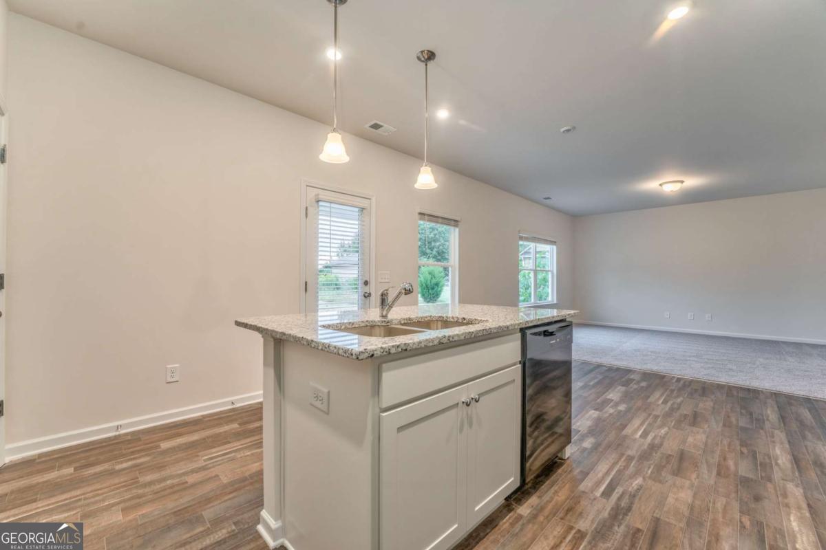 8 Majestic Oaks Way Northeast Rome, GA 30165 - Photo 10 of 25 a kitchen with a sink and wooden floor