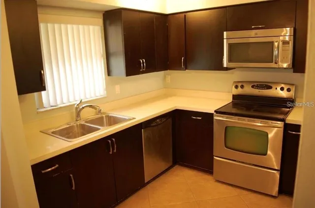 a kitchen with a stove and a microwave
