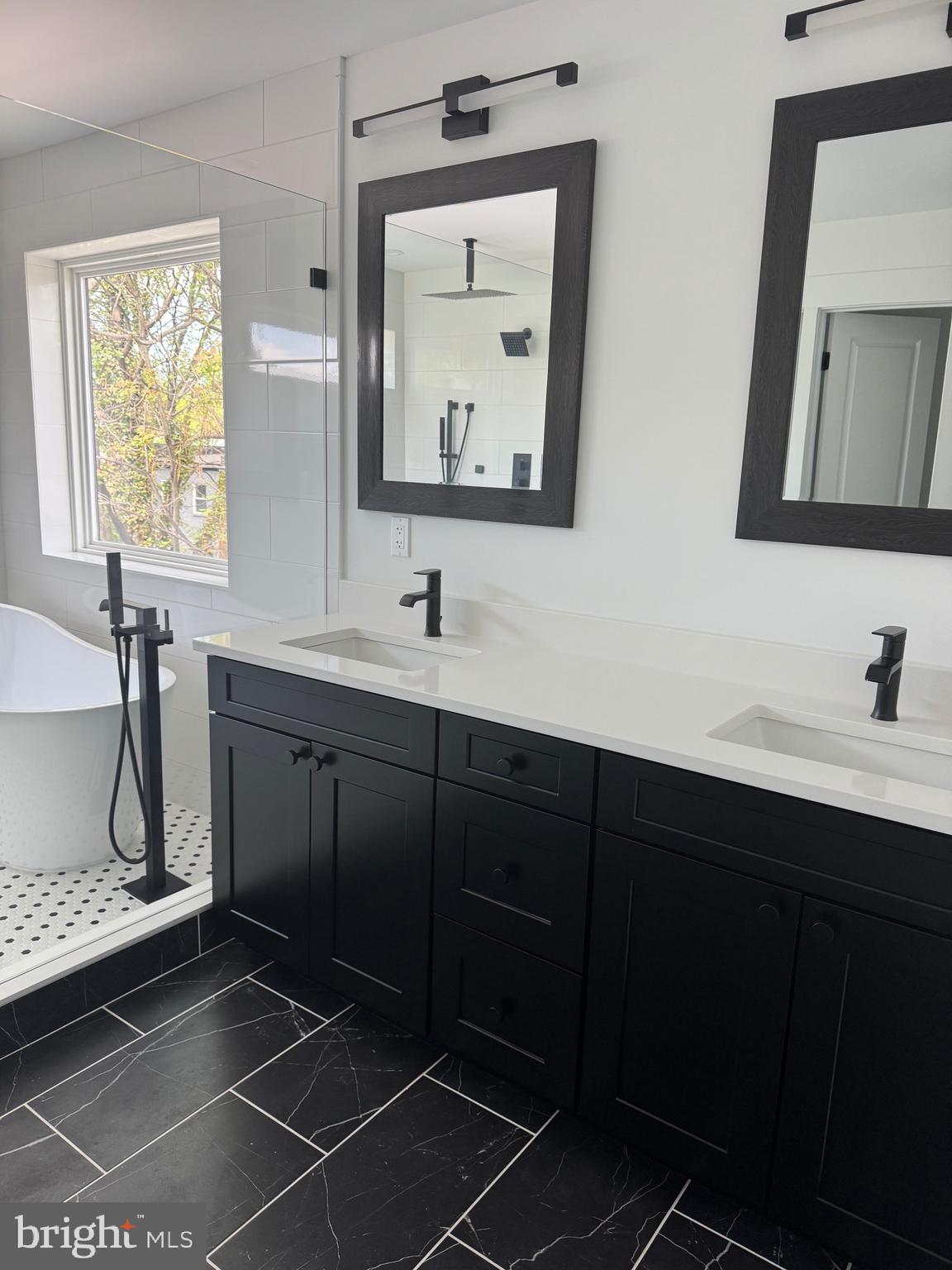 4626 Brooks Street Northeast Washington, DC 20019 - Photo 15 of 65 a bathroom with a double vanity sink and a mirror