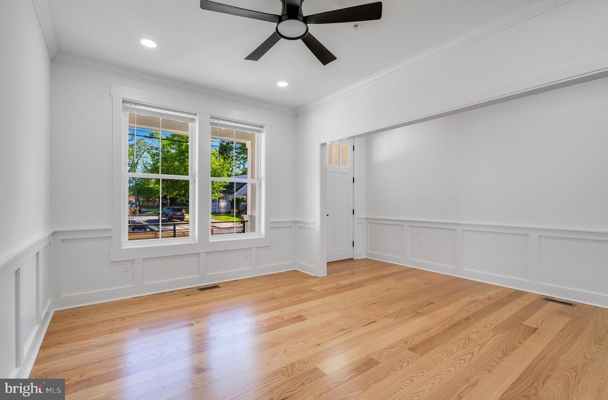 4626 Brooks Street Northeast Washington, DC 20019 - Photo 27 of 65 a view of an empty room with a window and wooden floor