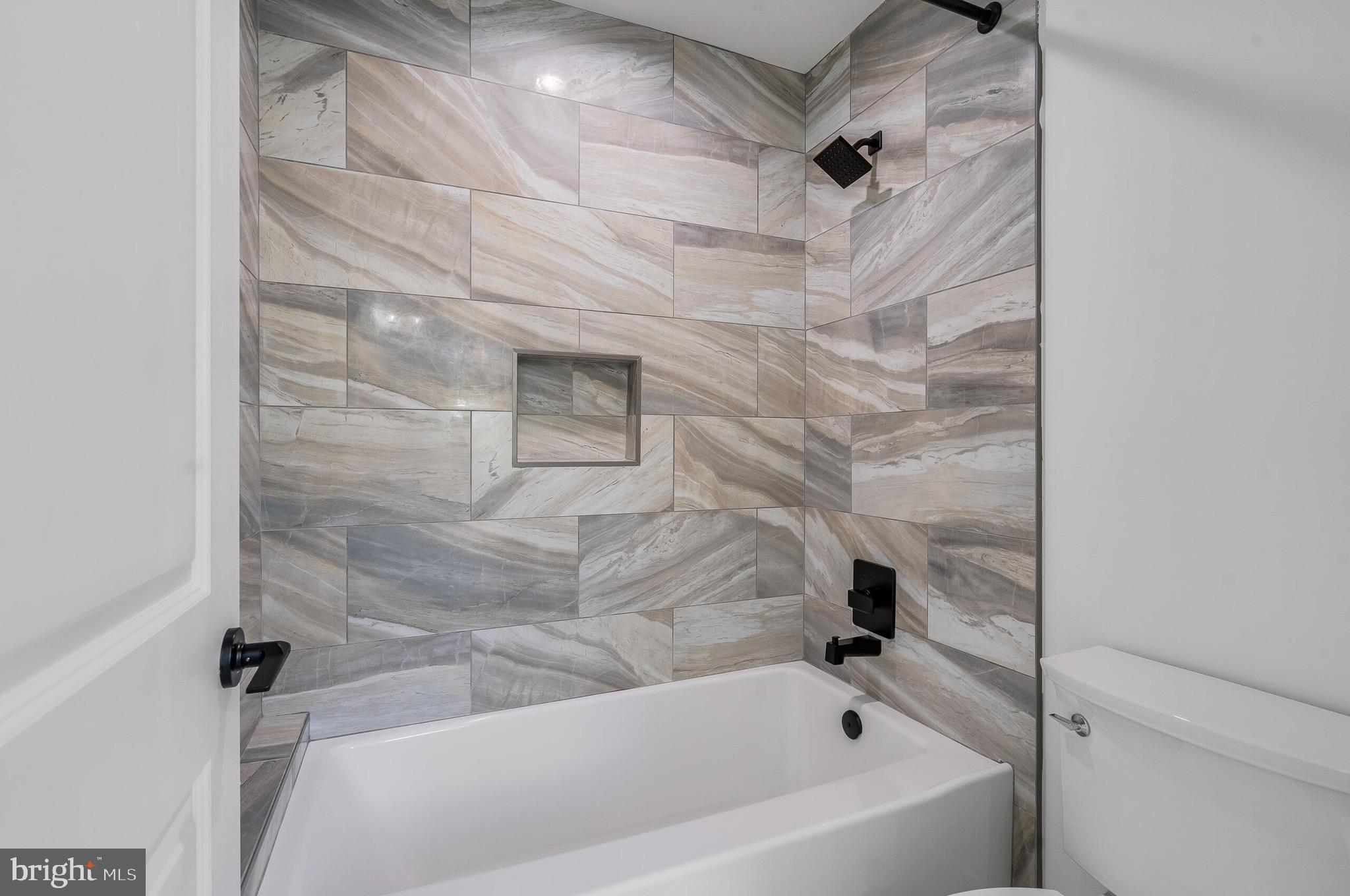 4626 Brooks Street Northeast Washington, DC 20019 - Photo 43 of 65 a bathroom with a bathtub