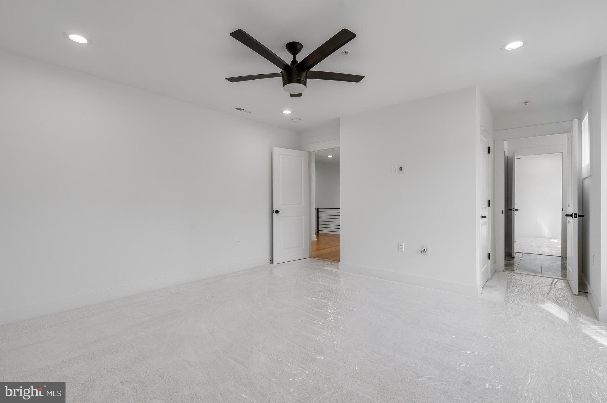 4626 Brooks Street Northeast Washington, DC 20019 - Photo 44 of 65 an empty room with ceiling fan and window