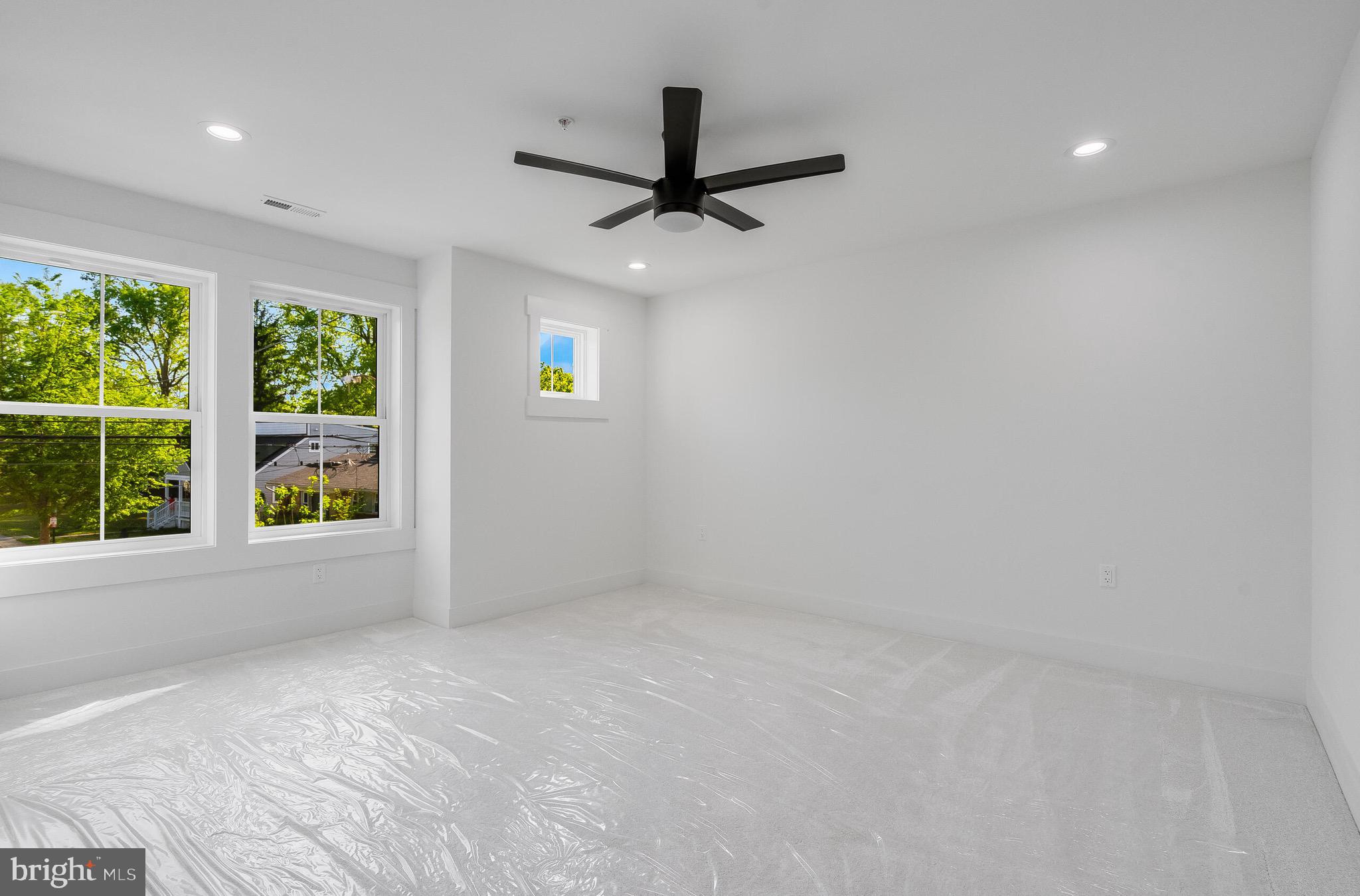 4626 Brooks Street Northeast Washington, DC 20019 - Photo 45 of 65 an empty room with a window and a ceiling fan