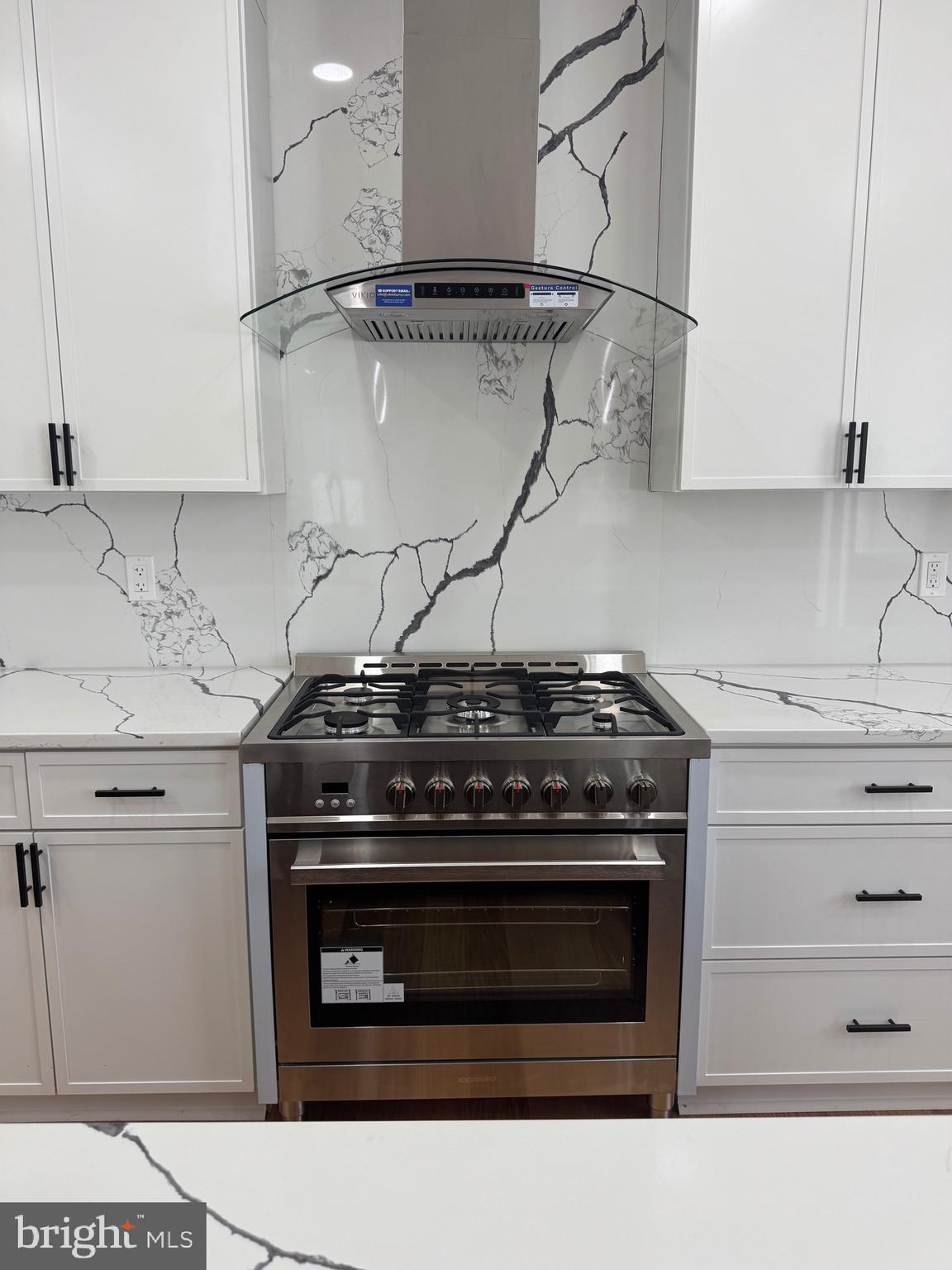 4626 Brooks Street Northeast Washington, DC 20019 - Photo 9 of 65 a stove top oven sitting inside of a kitchen