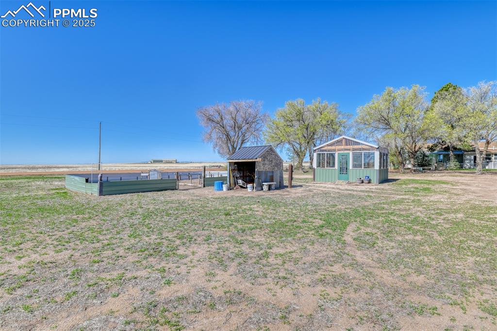 22500 Enoch Road Calhan, CO 80808 - Photo 28 of 39 a front view of a house with garden
