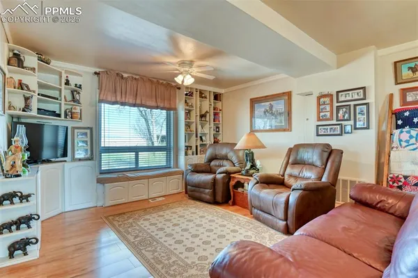 a living room with furniture and a window