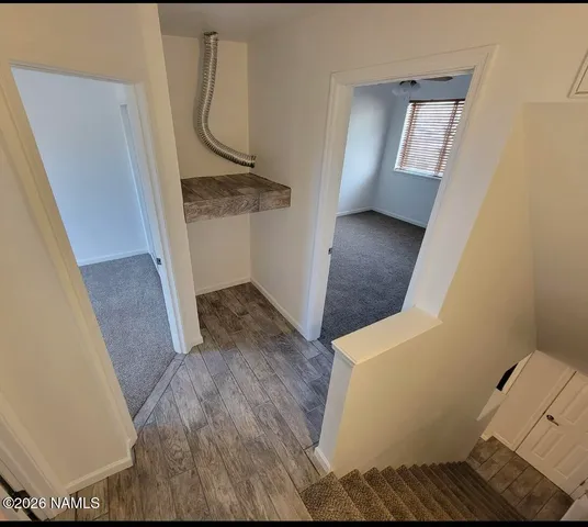 a view of entryway with wooden floor