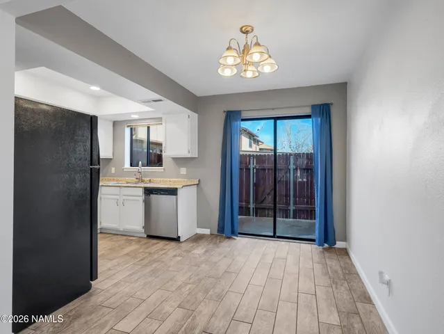 a kitchen with a refrigerator and a sink