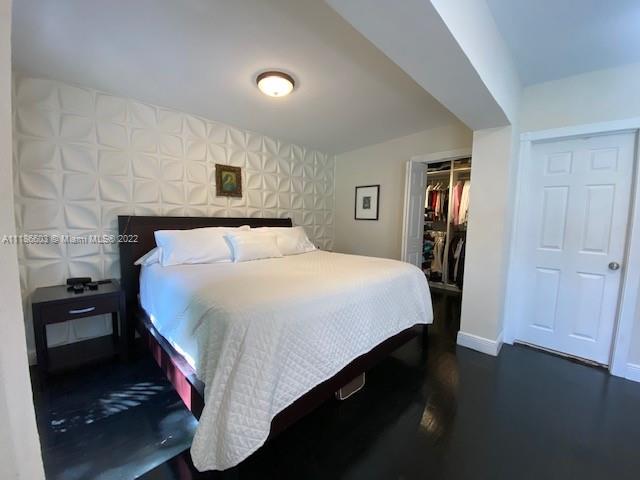 256 Southwest 30th Road Miami, FL 33129 - Photo 14 of 17 a bedroom with a bed and a night stand