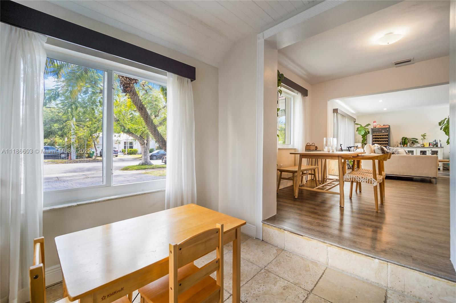 256 Southwest 30th Road Miami, FL 33129 - Photo 5 of 17 a view of a dining room with furniture and wooden floor