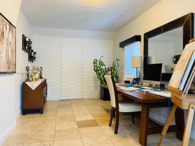 256 Southwest 30th Road Miami, FL 33129 - Photo 8 of 17 a view of a workspace with furniture