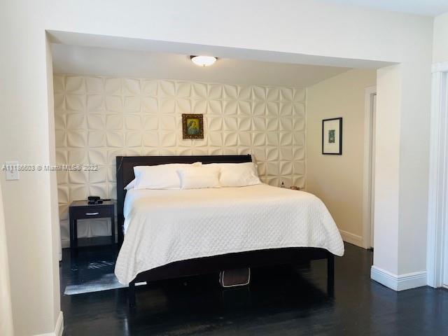 256 Southwest 30th Road Miami, FL 33129 - Photo 10 of 17 a bedroom with a bed and a night stand