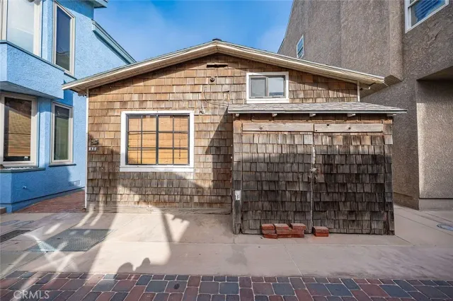 a front view of a house with glass windows