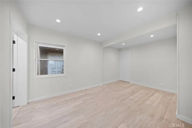 a view of hallway with wooden floor
