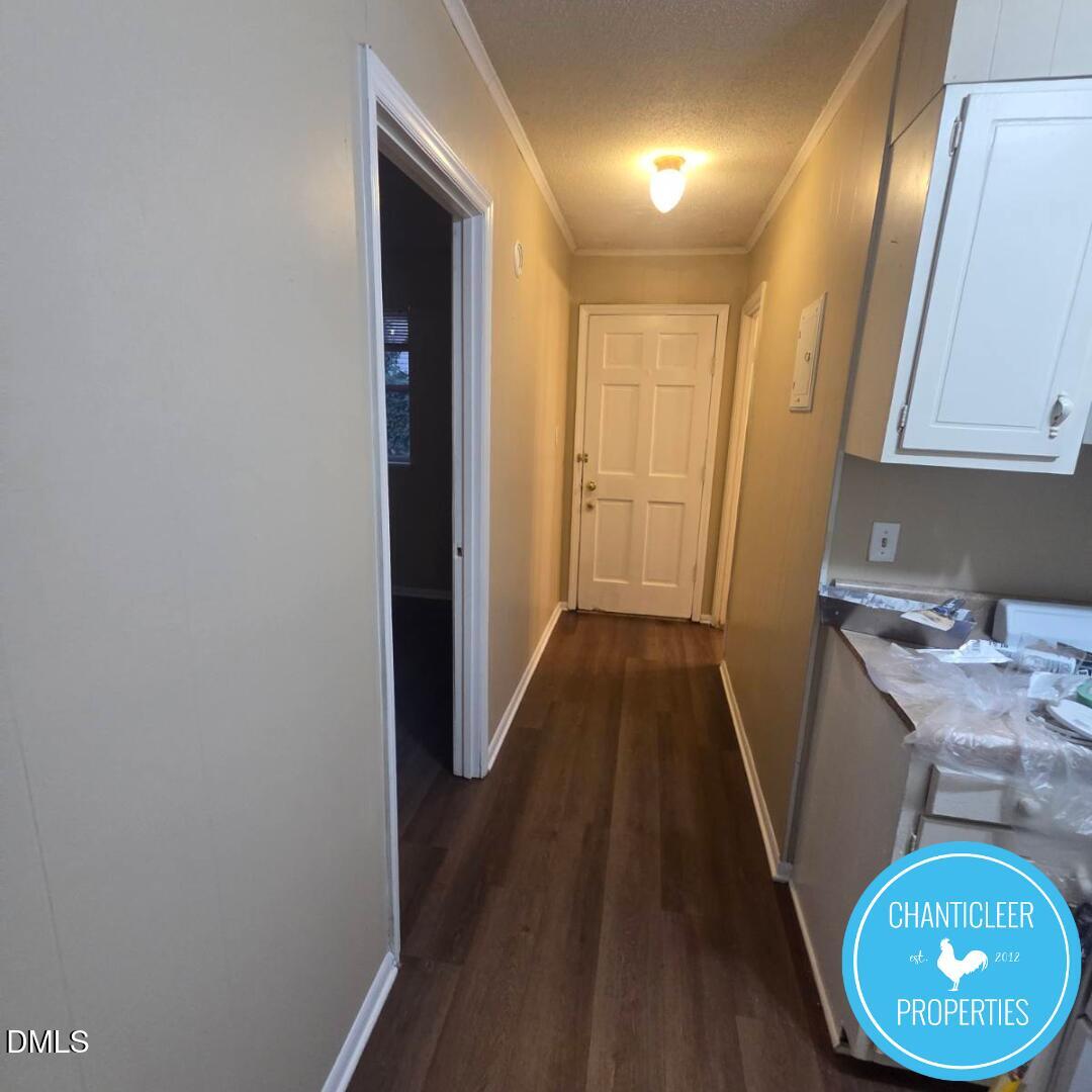 115 Florence Street, Unit 2 Graham, NC 27253 - Photo 4 of 12 a view of a hallway with wooden floor