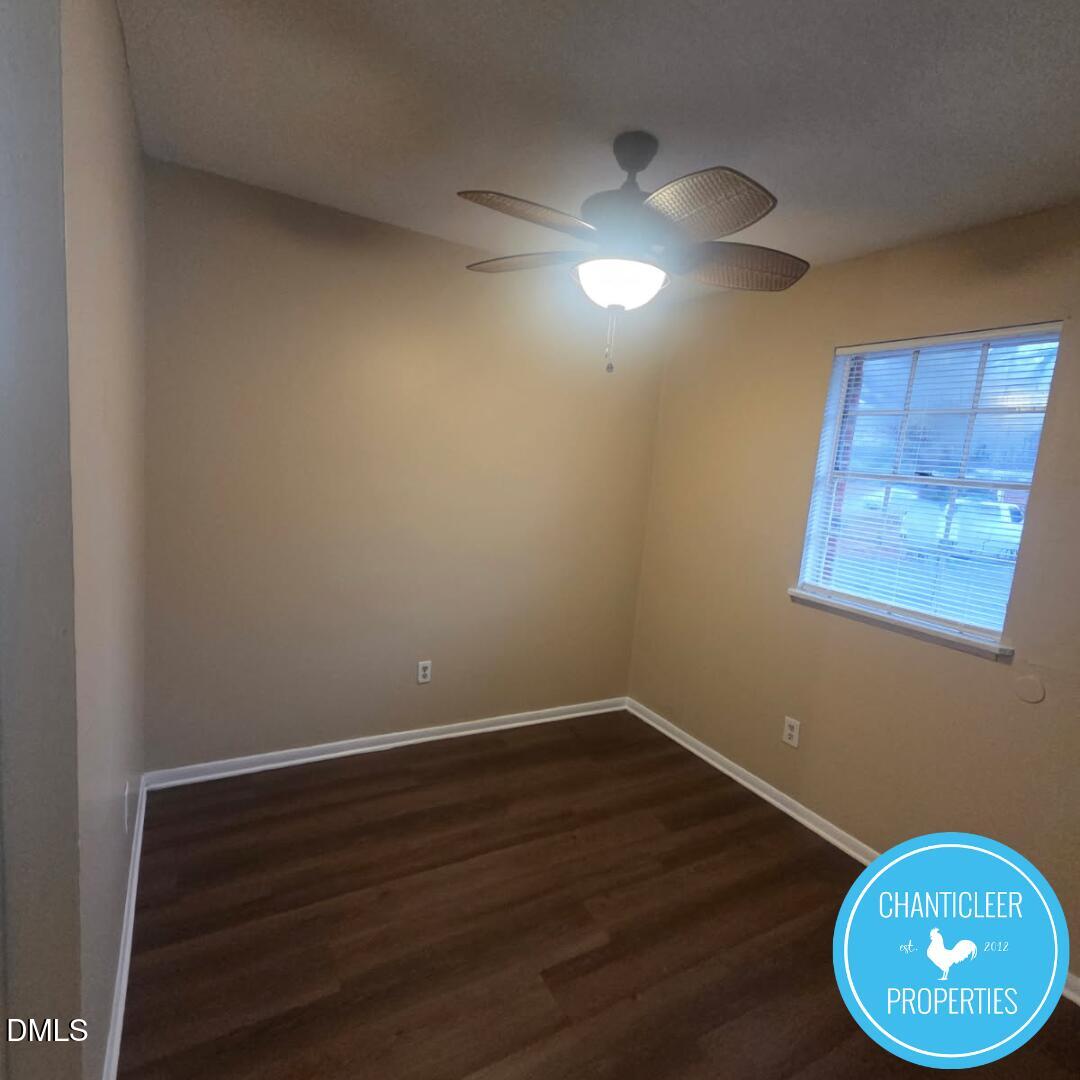 115 Florence Street, Unit 2 Graham, NC 27253 - Photo 7 of 12 a view of wooden floor and chandelier in a room