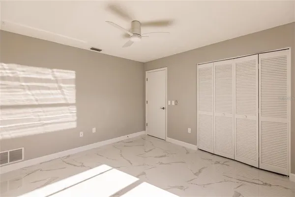 a view of an empty room with a window