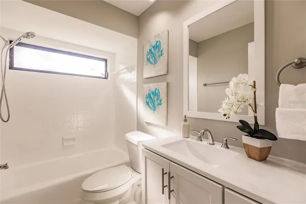 a bathroom with a sink a toilet and a bathtub