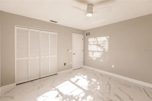 a view of an empty room with a window