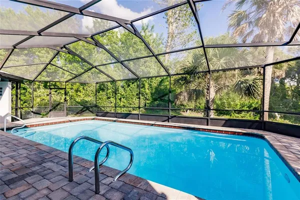 a view of indoor pool and sitting area
