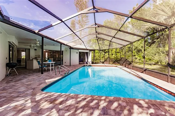 a view of a swimming pool with a patio